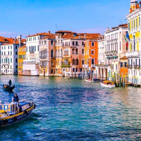 A canal in Venice surrounded by coloured buildings